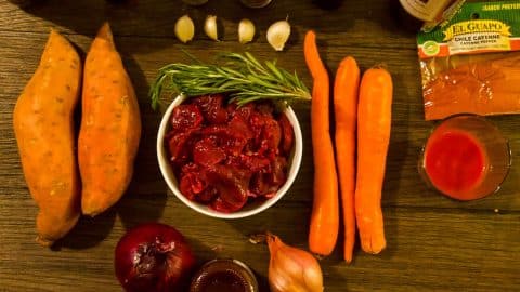 Elk stew recipe ingredients on a wooden table