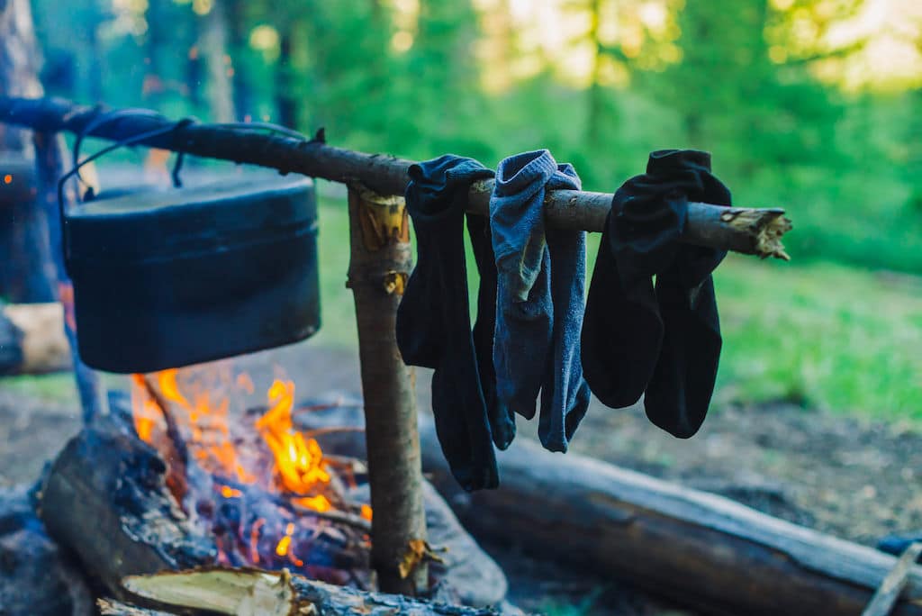 hunting socks Three pairs of hunting socks drying over a campfire