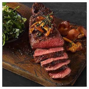 2023 Gift box for hunters with perfectly cooked steak laid across a cutting board