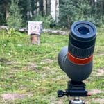 Spotting scope pointing towards an archery target in the distance on a September elk hunt in 2022