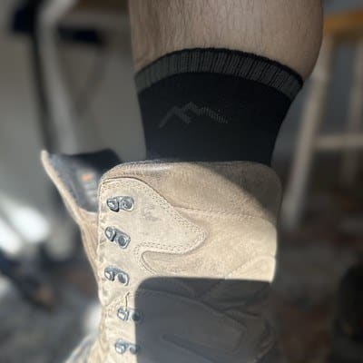 darn tough sock sticking out of zamberlan hunting boot