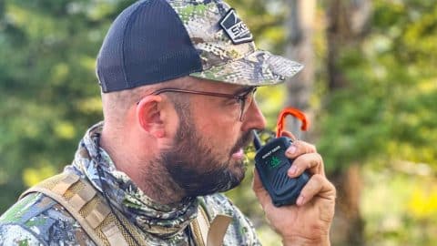 josh rocky talkie review 2022 Hunter wearing camo talking into a compact, rugged two-way radio