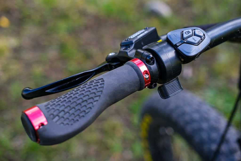 Close up of handlebar, throttle, and pedal assist buttons