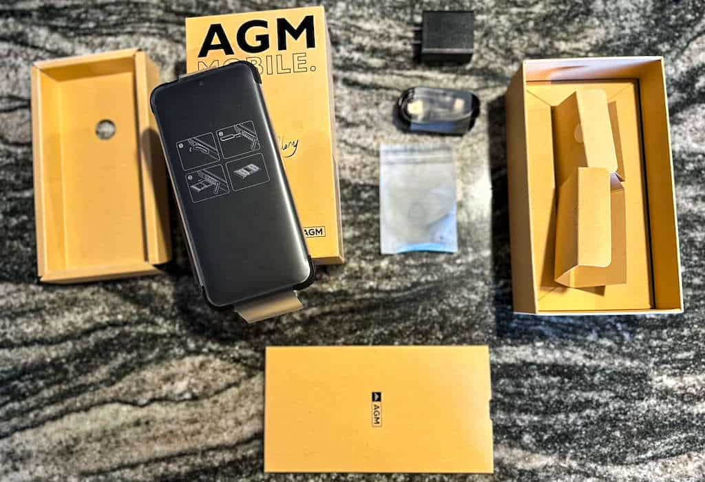 Brand new cell phone with its packaging on a marble countertop