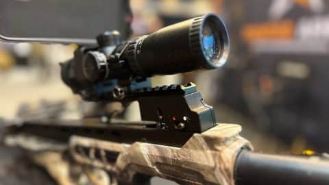 CenterPoint hunting crossbow with mounted illuminated scope on display at SHOT Show