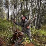 Final Stalk cofounder Moose with a bull elk taken using a mechanical broadhead in a Colorado aspen stand