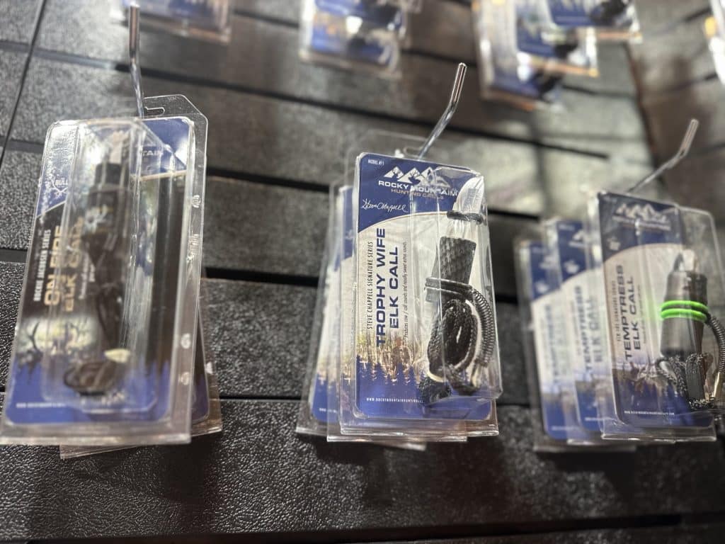 Rocky Mountain Hunting Calls elk cow calls including the Trophy Wife and Temptress on a retail display rack